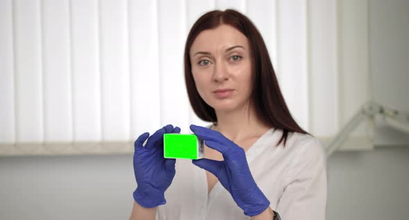 Close Up Of Confident Medical Woman Looking Camera Speech Pills Box Info alt