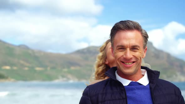 Portrait of happy couple embracing each other alt