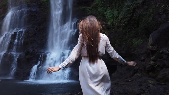 Young beautiful sexy woman in long white dress go to waterfall Tad Yuang, Laos Asia, Travel, 4K Slow alt