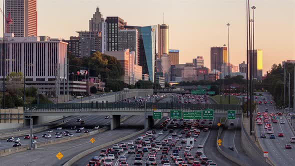 Downtown Atlanta, Georgia Skyline and Freeway Traffic Golden Hour alt