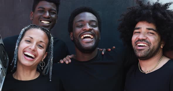 Group of young multiracial people smiling on camera alt