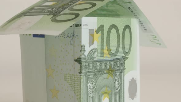 Slow tilt real estate metaphor of EU paper money 4K 2160p 30fps UHD  footage - Close-up of hundred E alt