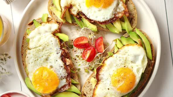 Delicious Healthy Breakfast with Sliced Avocado Sandwiches with Fried Egg