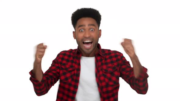Portrait of Excited Mixedrace Man with Super Hairdo and Bristle Being Excited Expressing Delight alt