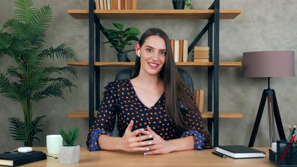 Woman teacher coach greets looks camera records online master class webinar, distance education alt