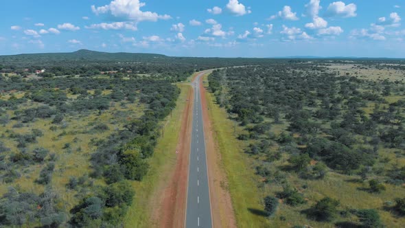Africa adventure travel, drone flight in a Botswana road