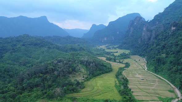 Landscape around the city of Vang Vieng in Laos seen from the sky alt