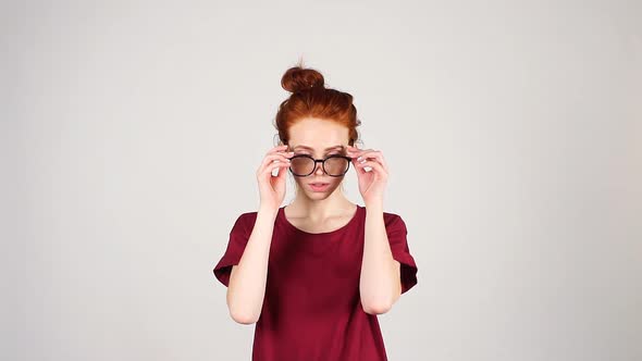 Portrait of Young Redhead Girls with Glasses.