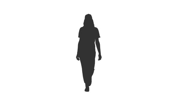 Silhouette of Young Woman Walks in Cap and Sports Wear