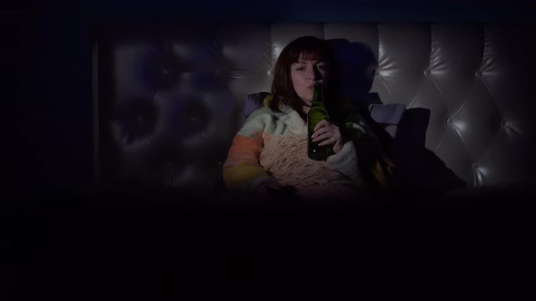 Happy Woman on Bed Drinking Beer and Watching Tv Dancing Good Mood