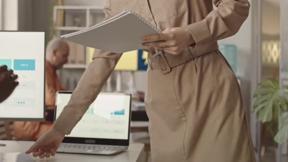 CEO of Digital Marketing Agency Handing out Annual Report to Employees alt