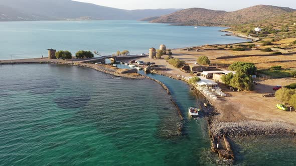 Aerial View of a Motor Boat in a Deep Blue Colored Sea. Kolokitha Island, Crete, Greece