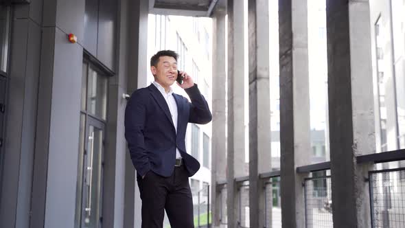 portrait successful young confident businessman talking background modern office  alt