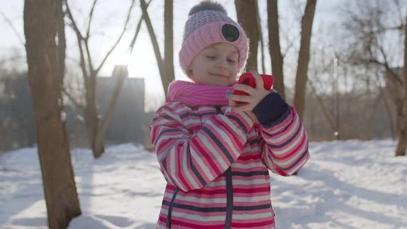 Child Girl Vlogger Making Video Call Chatting with Friends Distance Communication in Winter Park alt