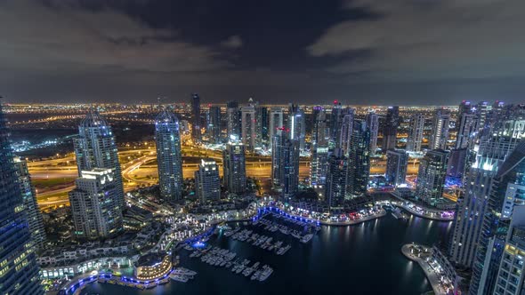Dubai Marina Skyscrapers and Jumeirah Lake Towers View From the Top Aerial Night Timelapse in the alt