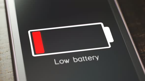 Generic smartphone with flashing low battery symbol. The battery is exhausted.