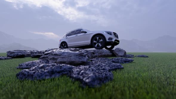 White Luxury Off-Road Vehicle Standing on Rocks in Rainy Weather