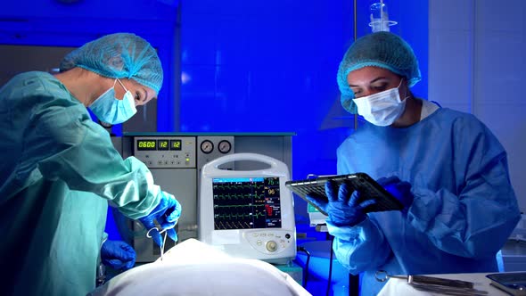 Female Medics Performing Surgery in Operating Theater