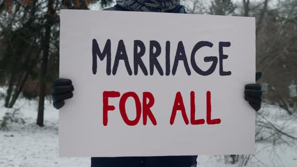 Activist Supports LGBT Rights Equality By Demonstrating Marriage For All Placard alt
