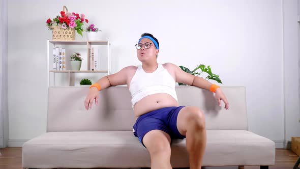 Fat Asian glasses man in sportswear crave looking and whistling sexual harassment girl or woman alt