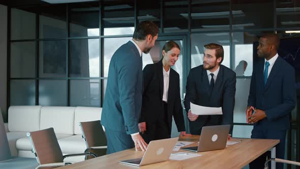 Young people at a business meeting. Business partners applauding alt