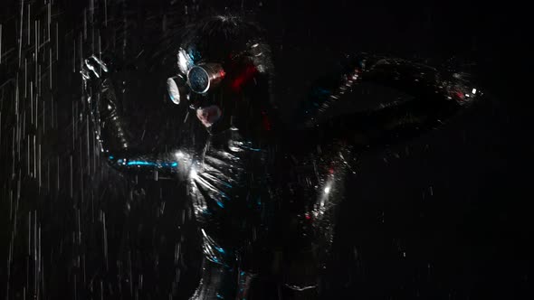 Extravagant Dancer in Rain Woman is Wearing Black Latex Suit and Face Mask for Bdsm Roleplay alt