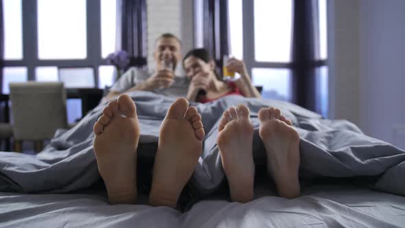 Bare Feet Of Young Couple Under Blanket By Stusya VideoHive