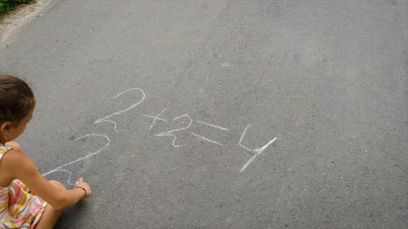 The Child Writes Equations on the Asphalt alt