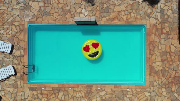 Float smile emoji emoticon icon buoy at swimming pool at countryside alt