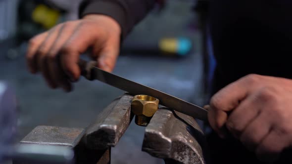 Worker's Hand In The Garage Metal Filing