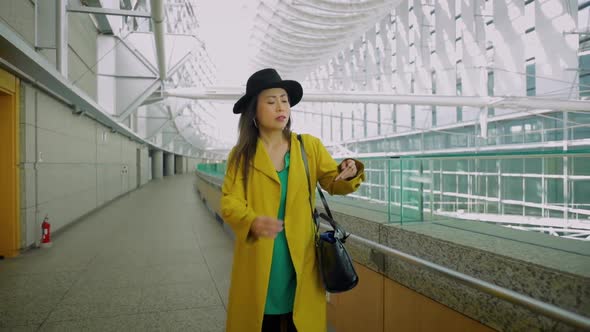 Japanese woman walking in Tokyo Japan alt