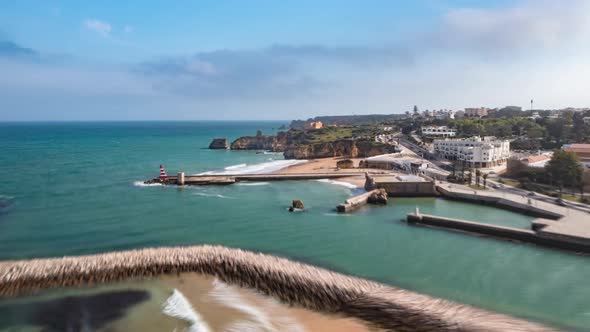 Aerial Hyperlapse of Lagos Harbor Near Amazing Beach Shore Coastline By Lagos Portugal Drone Rising alt