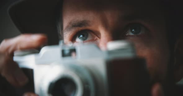Male photographer taking pictures close up view alt