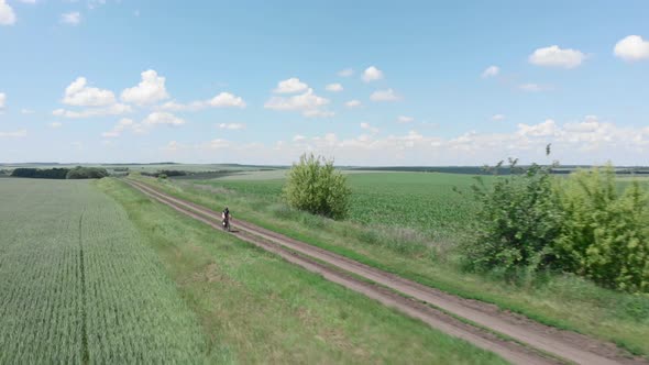 Aerial Gravel Dirt Road Cycling. Bicycle on Gravel bike alt