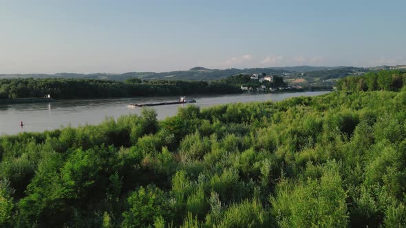 A slow bargeing upstream the Danube on a beautiful summer's day. alt