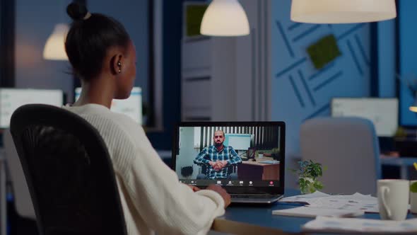 African Businesswoman Having Corporate Meeting with Remotely Paralyzed Man alt