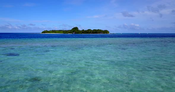 Natural overhead copy space shot of a white sandy paradise beach and aqua blue ocean background in h alt