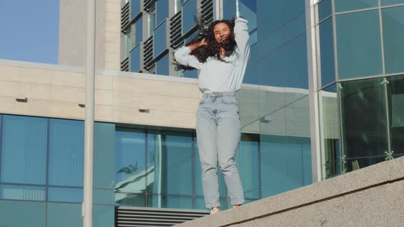 Happy Joyful Carefree Girl Active Moving Dancing Woman with Long Hair Lady Student Winner Dance alt