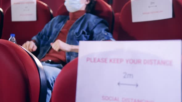 Social Distancing Sign in a Movie Theater alt