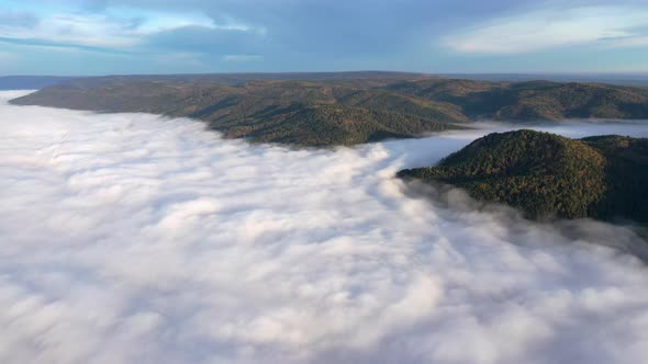Aerial Hyperlapse of Fog in a Mountain Gorge at Dawn.