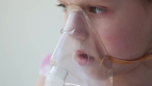 Close up children mouth makes an inhalation vapor