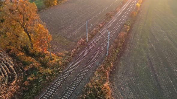 Aerial View of Railway Track Among Agricultural Fields alt