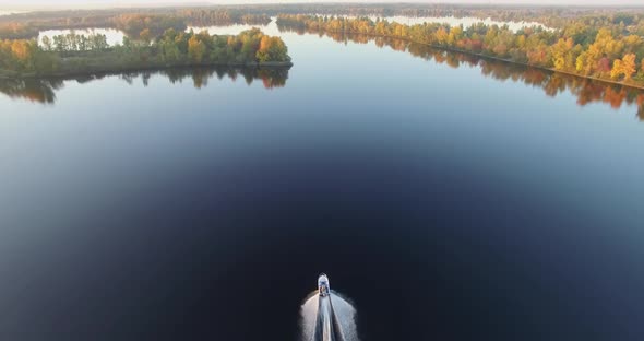 Boat Floating On River Aerial. Fall Wood Woodland On Drone. Water Tourism On Boat. Rest On River. alt