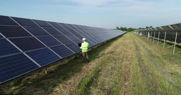 Solar Power Engineer Working on a Solar Farm