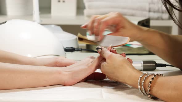 Manicurist Hands Make Female Manicure In The Nail Salon