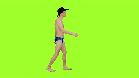 Topless Man in Cowboy Hat Waving Hello While Walking