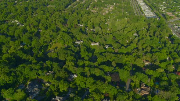 Aerial Tilt Up Shot of the Village of Roslyn Long Island alt
