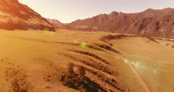Aerial Rural Mountain Road and Meadow at Sunny Summer Morning alt