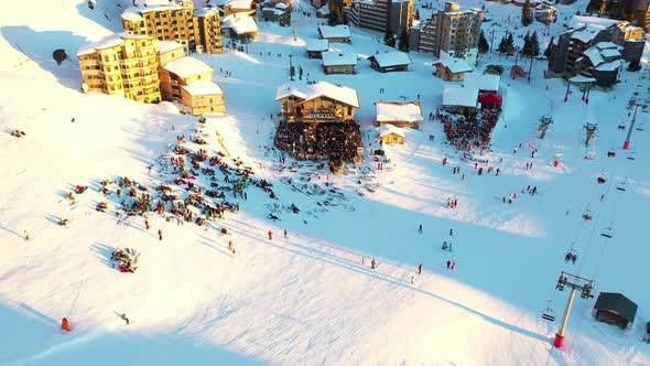Aerial view of people resting in a ski resort, France. alt