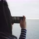 Back view of Asian woman taking a picture through the window on boat - VideoHive Item for Sale